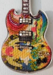 The Fool Guitar pin in detail